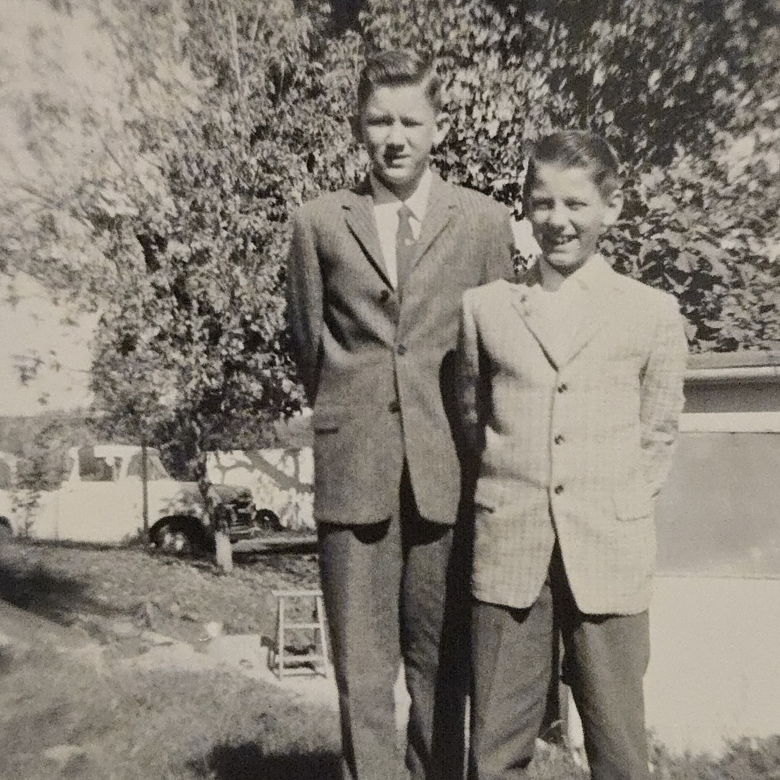 Vintage B&W Photograph of 2 Young Boys in Suits Standing Outside Together Vintage B&W Photograph of 2 Young Boys in Suits Standing Outside Together