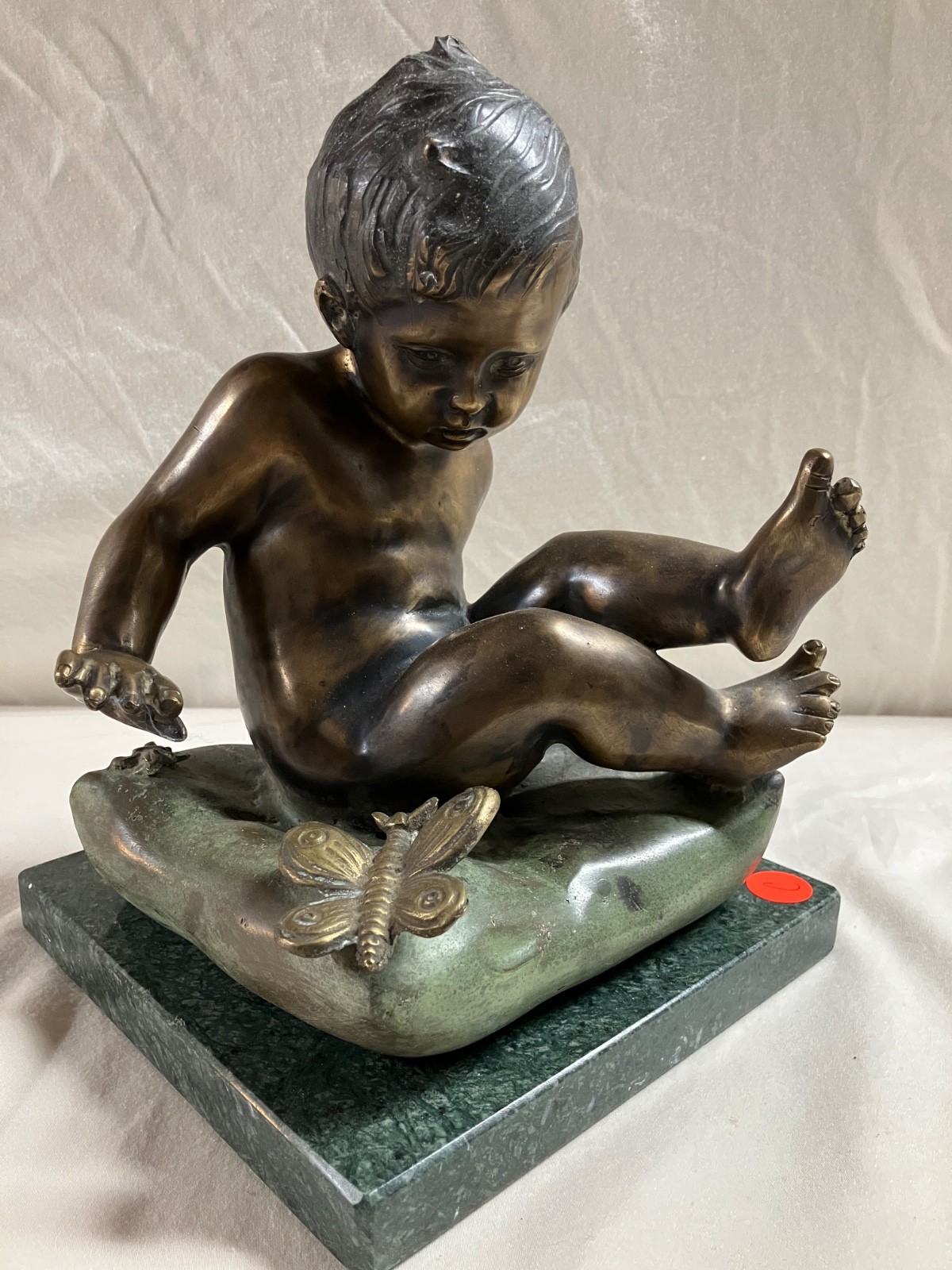 Ferdinando de Luca Bronze boy baby child sitting with dragonfly or butterfly Ferdinando de Luca Bronze boy baby child sitting with dragonfly or butterfly