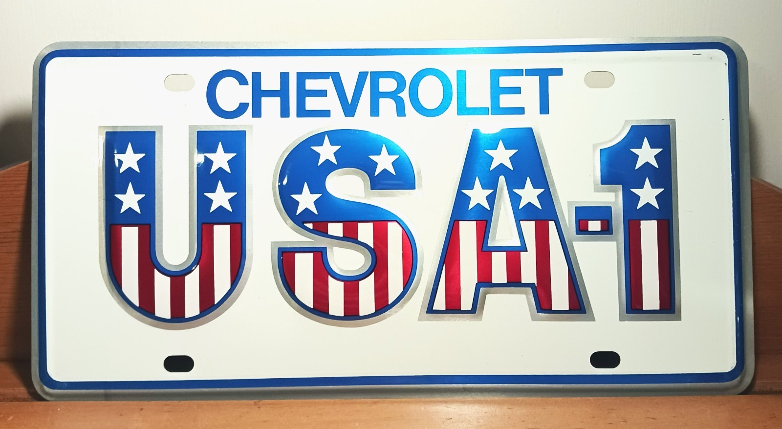 Vintage GM Chevrolet Dealer USA-1 Small Hole Embossed Metal License Plate - MINT