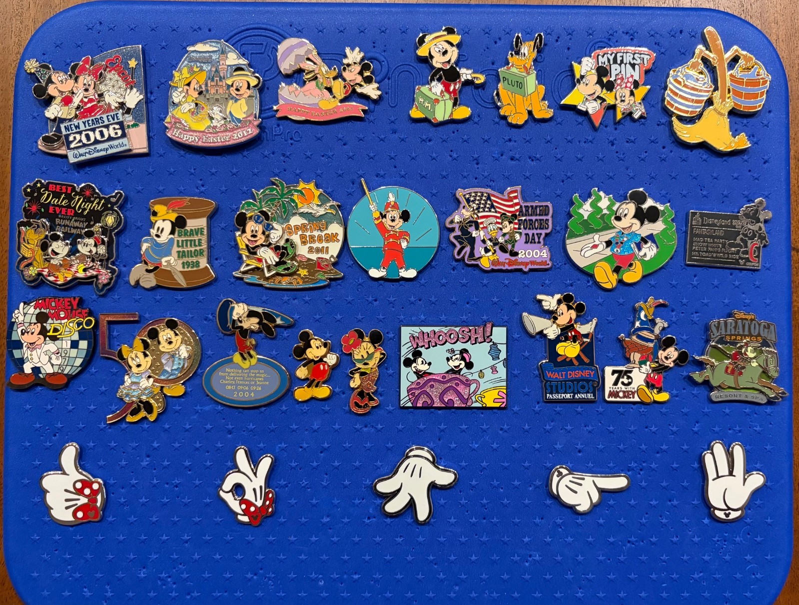 Disney pin lot featuring Mickey and Minnie along with Pluto plus artist proof