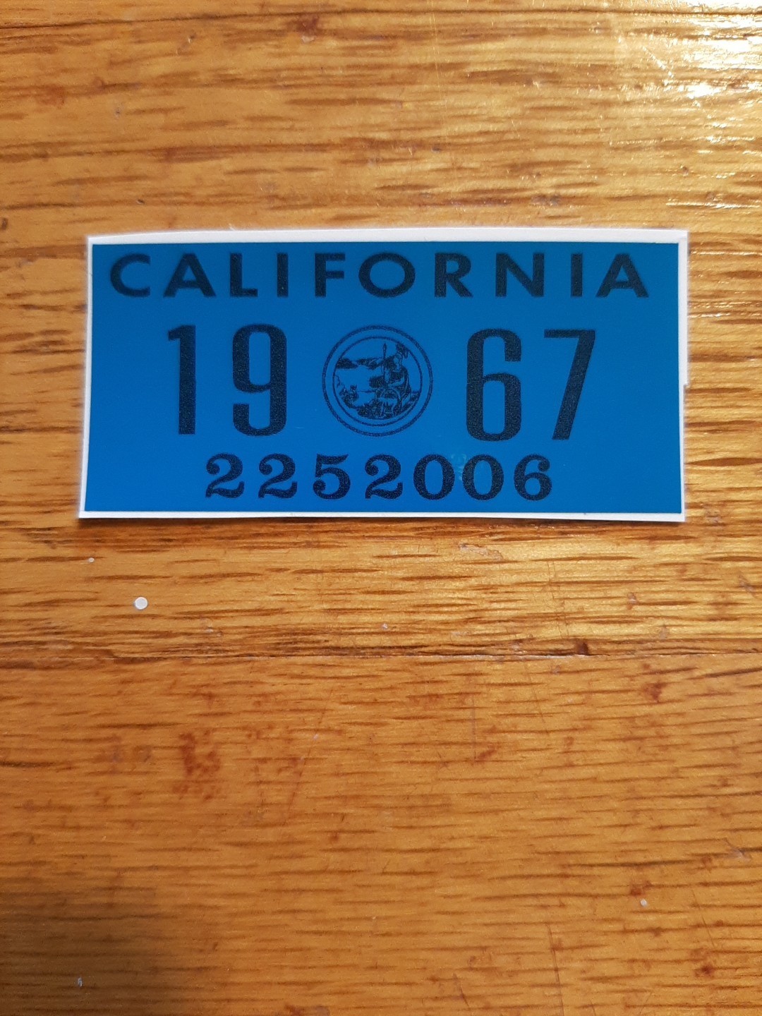 1967 California license plate registration YOM DMV sticker. 