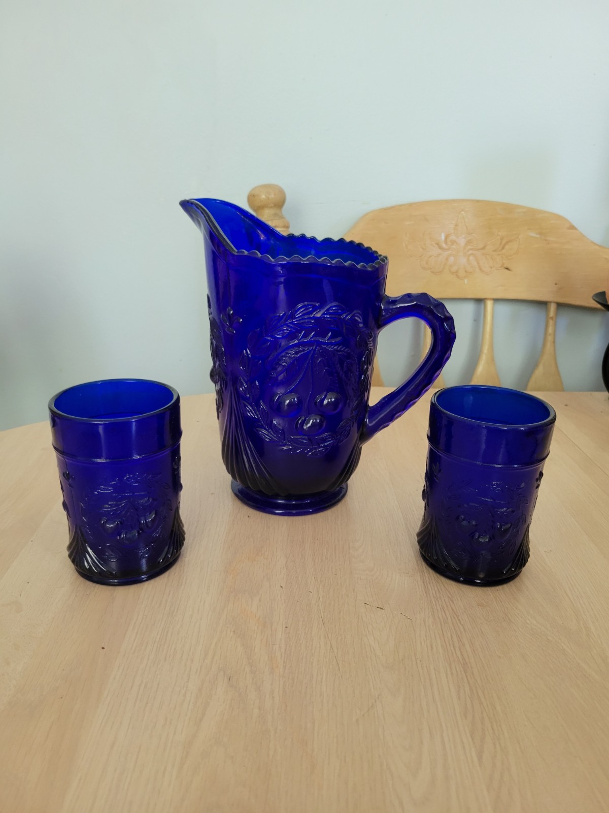 Vintage cobalt blue pitcher and 2 cups, cherry embossed
