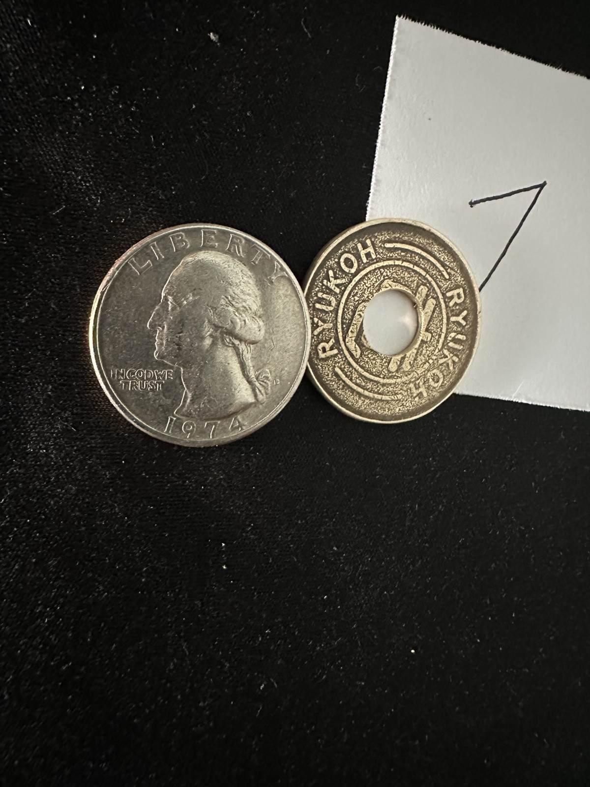 Chinatown Coin magic Set, Using a Japanese token and a quarter Chinatown Coin magic Set, Using a Japanese token and a quarter