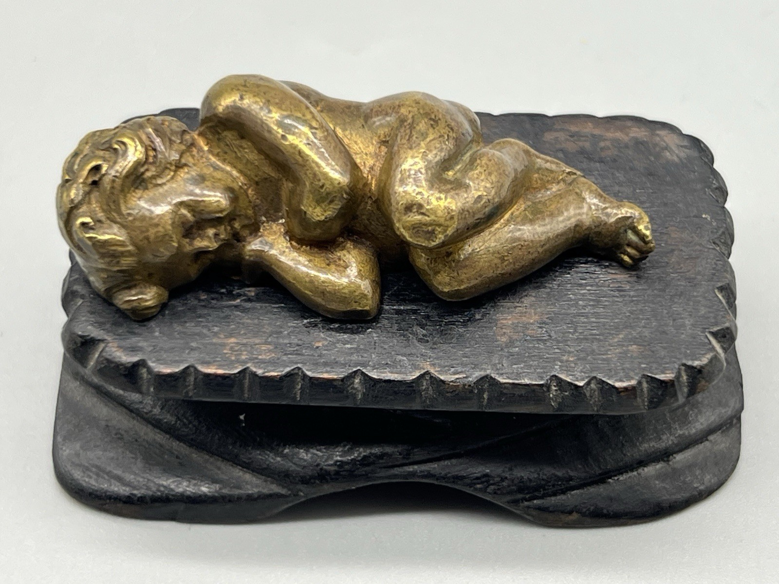 Antique Cast Bronze Sleeping Christ Child on a Hand Carved Wood Manger Antique Cast Bronze Sleeping Christ Child on a Hand Carved Wood Manger