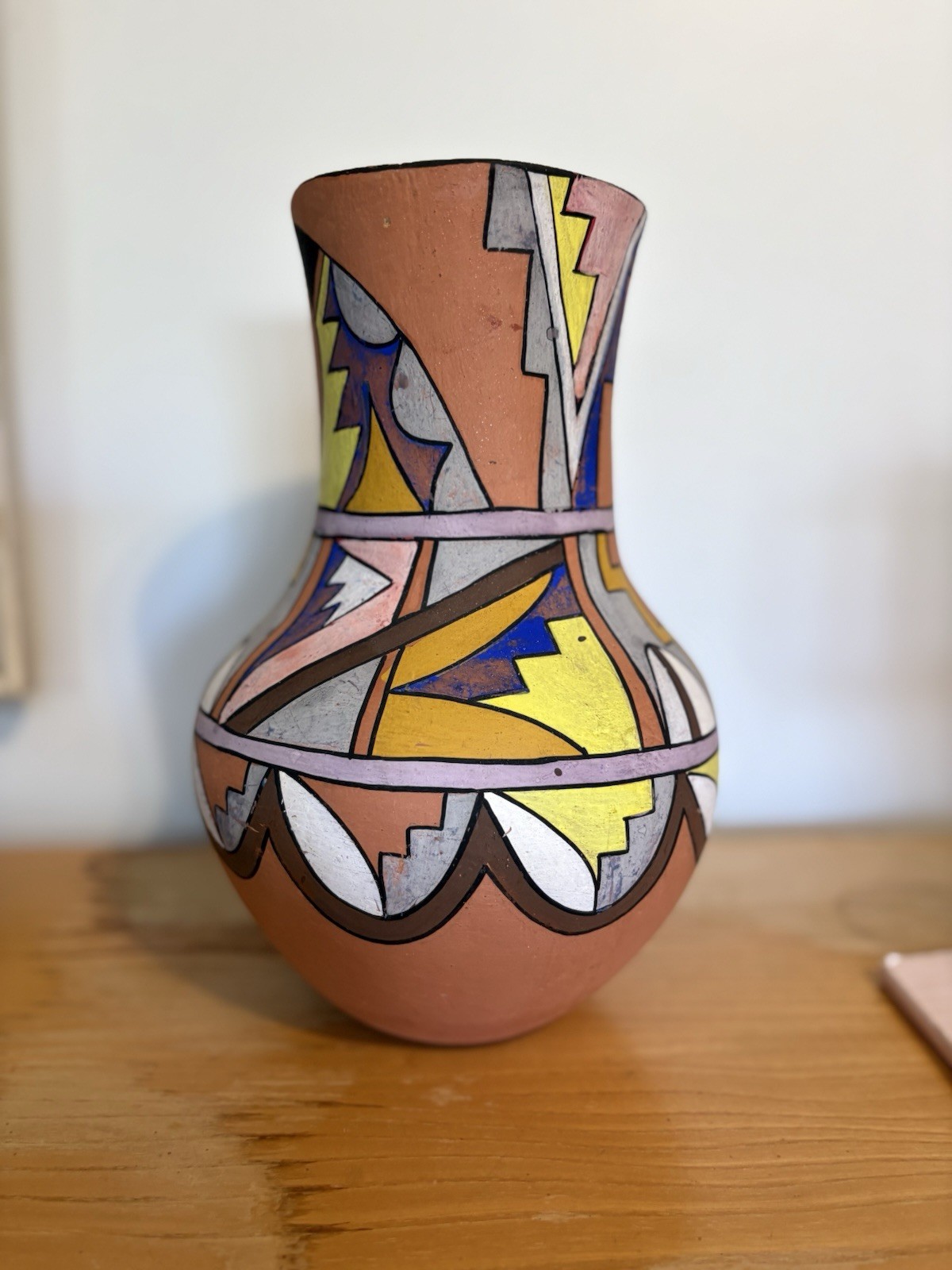 Vintage Jemez Pueblo polychrome ceramic vase with geometric painted designs. Vintage Jemez Pueblo polychrome ceramic vase with geometric painted designs.