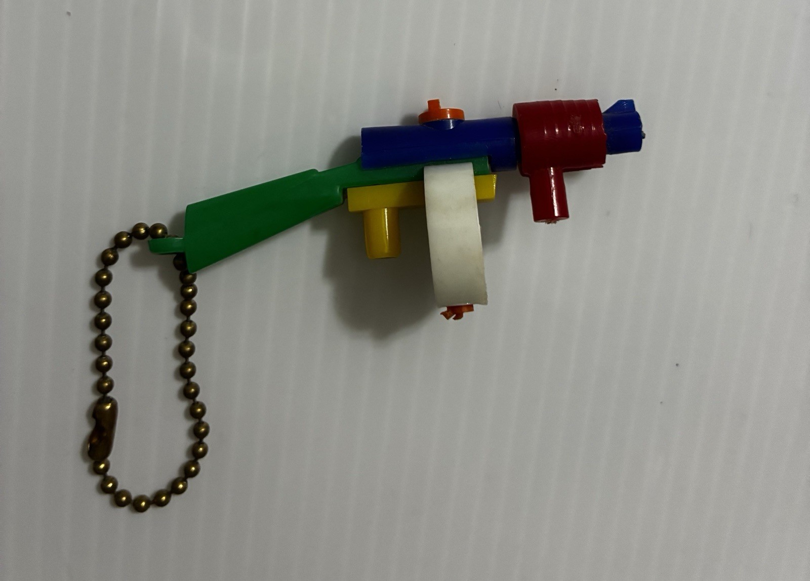 Vintage 1950’s Thompson Machine Fun/Tommy Gun Puzzle Keychain