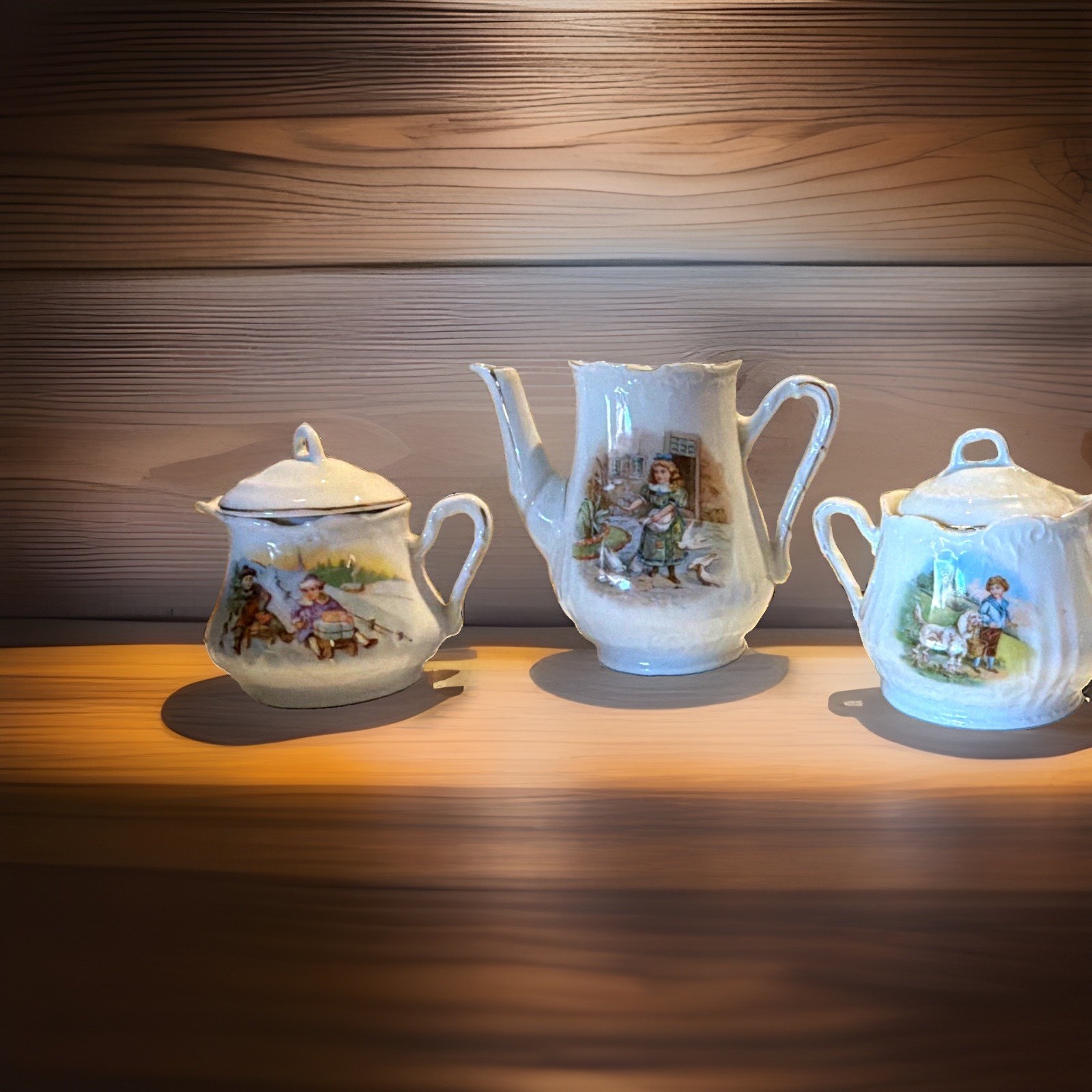 Early 1900s Porcelain Child’s Tea Set – Children Scenes – Silver/Metallic Trim Early 1900s Porcelain Child’s Tea Set – Children Scenes – Silver/Metallic Trim