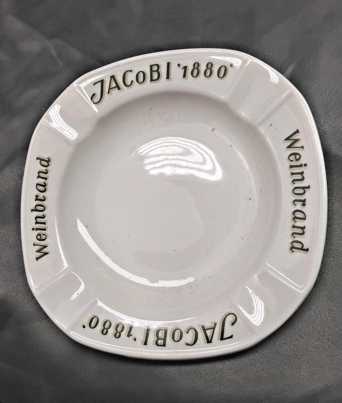 Jacobi 1880 weinbrand ceramic large ashtray four slot mfg, by Fischer co. Jacobi 1880 weinbrand ceramic large ashtray four slot mfg, by Fischer co.