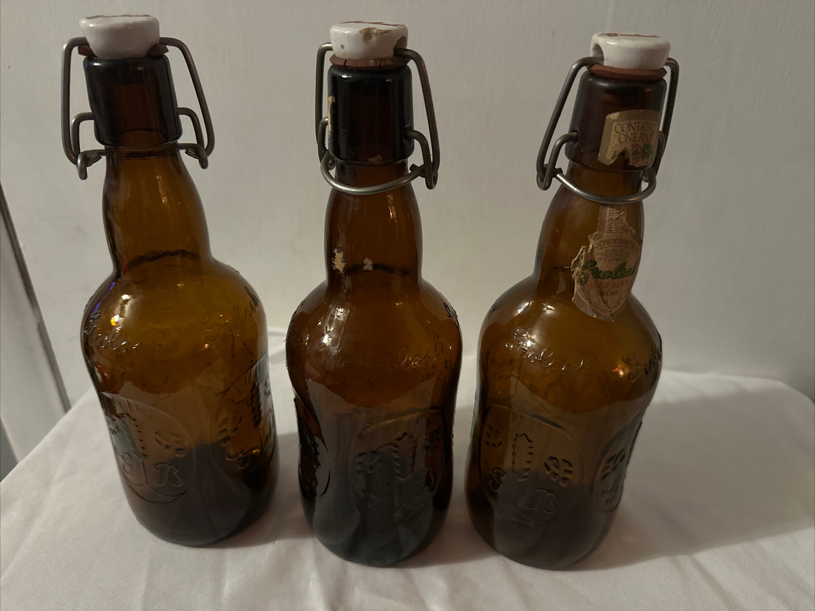 3 Vintage Grolsch Georga Brown Glass Beer Bottles with Porcelain swing top. 3 Vintage Grolsch Georga Brown Glass Beer Bottles with Porcelain swing top.