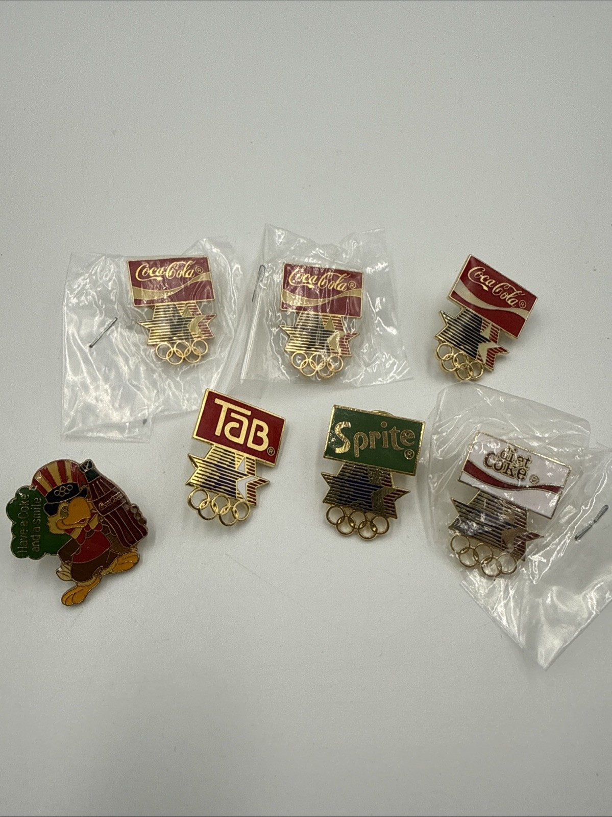 Lot of 7 LA Los Angeles 1984 Olympic Games Coca Cola Pins Mascot Sprite Coke Lot of 7 LA Los Angeles 1984 Olympic Games Coca Cola Pins Mascot Sprite Coke