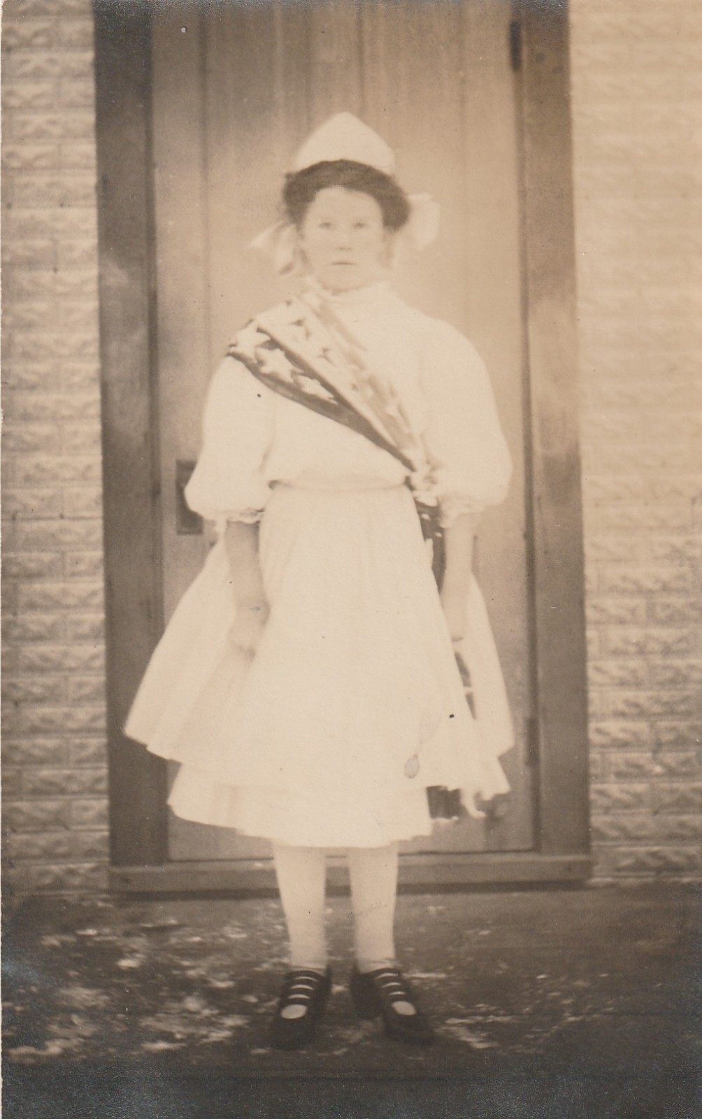 RPPC   Girl in Fancy Dress with Ornate Sash   Circa 1910 to 1920