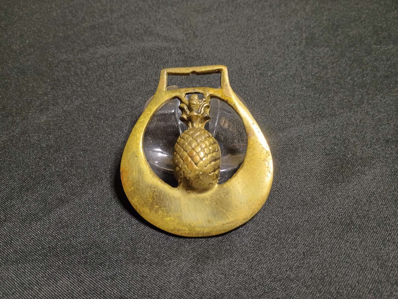 vintage solid brass horse brass medallion with a pineapple in the center