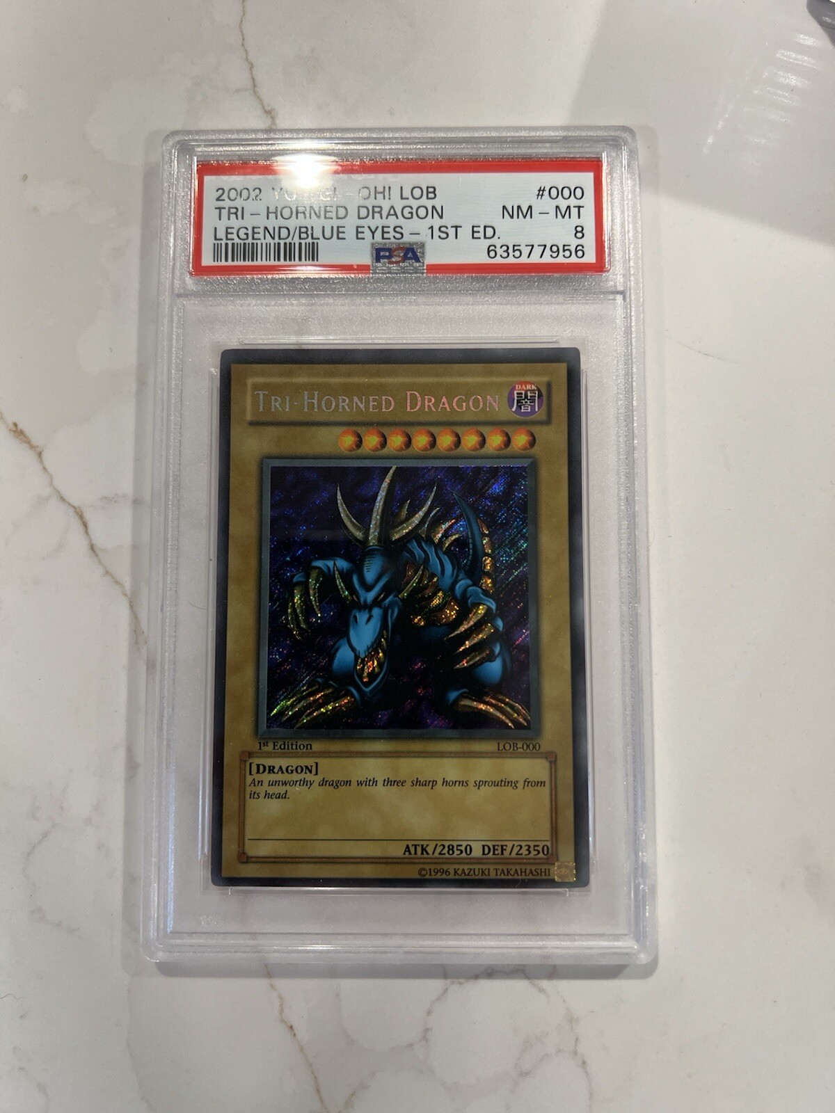 Yugioh PSA 8 Tri-Horned Dragon LOB-000 1st Edition - Secret Rare (Wavy Print) Yugioh PSA 8 Tri-Horned Dragon LOB-000 1st Edition - Secret Rare (Wavy Print)