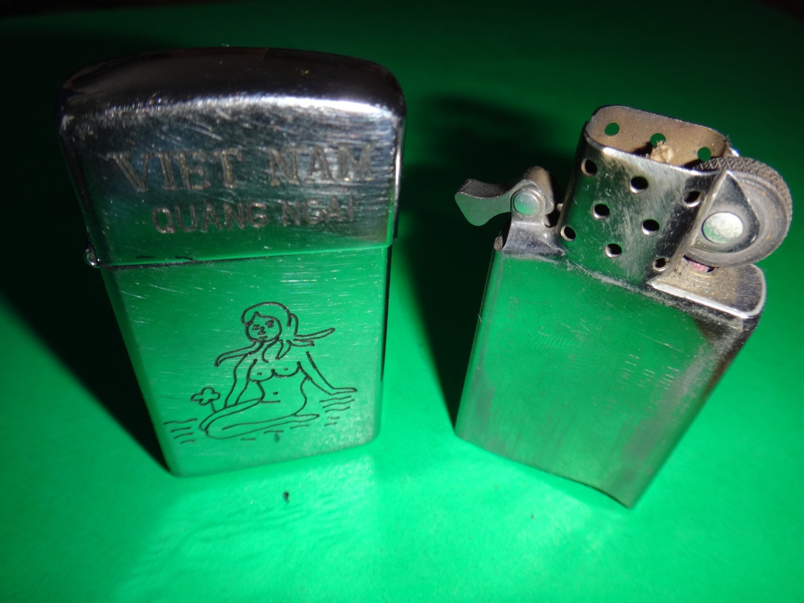 Zippo Slim Lighter VIETNAM QUANG NGAI and NUDE LADY Logo Zippo Slim Lighter VIETNAM QUANG NGAI and NUDE LADY Logo