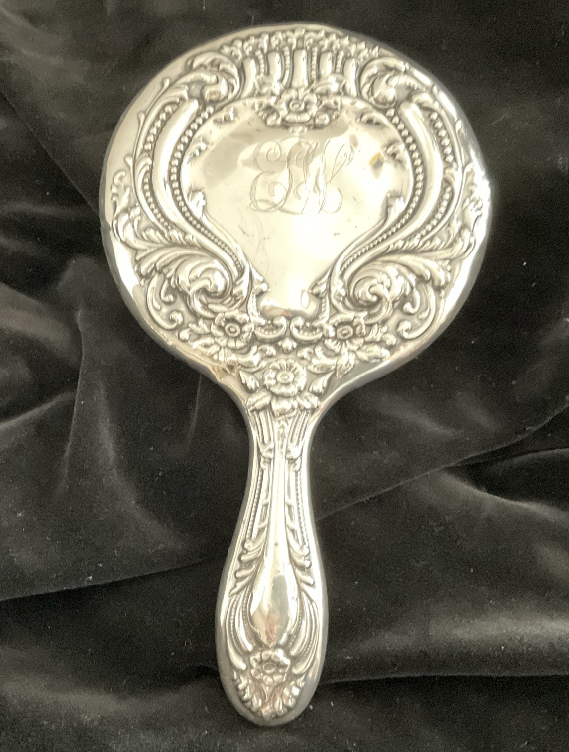 Ornate sterling silver hand mirror with monogram Ornate sterling silver hand mirror with monogram