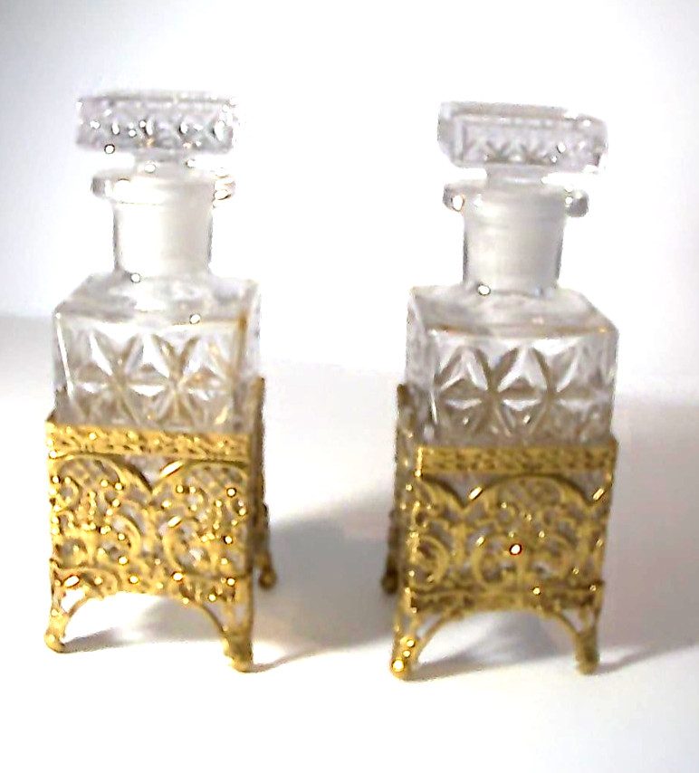 PAIR OF VINTAGE CRYSTAL GLASS DECANTERS WITH GOLD BRASS HOLDERS 7 PAIR OF VINTAGE CRYSTAL GLASS DECANTERS WITH GOLD BRASS HOLDERS 7