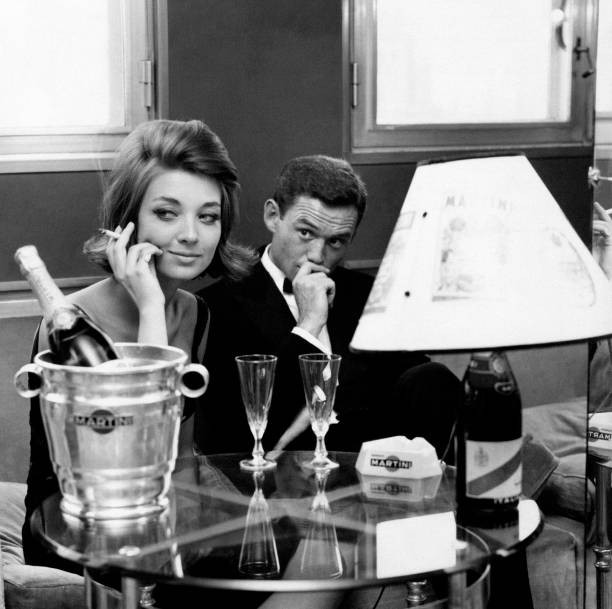 Two models sitting in a caf� 1960s Historic 1960s Old Photo