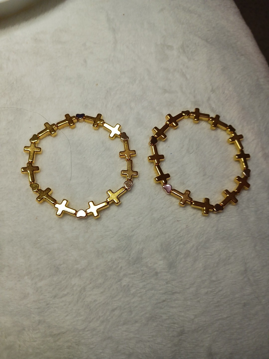 2 Pretty, Unique Goldtone Cross And Heart 6 Inch Bracelets On An Elastic Cord. 2 Pretty, Unique Goldtone Cross And Heart 6 Inch Bracelets On An Elastic Cord.
