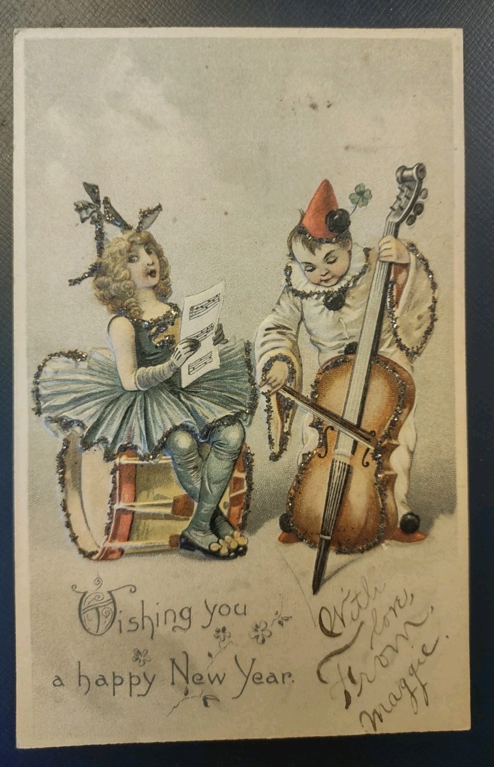 1900s Happy New Year Postcard Pierrot Clown Cello Costumed Girl Drum Mica Trim 