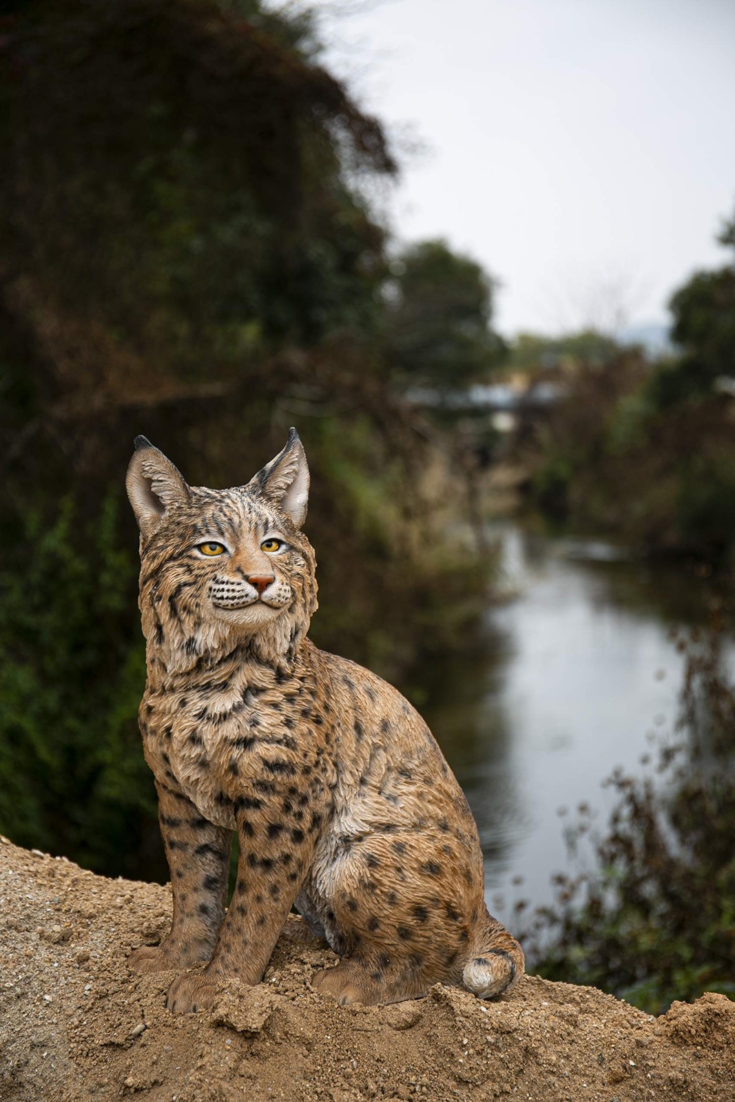 Hi-Line Gift Ltd. Sitting Bobcat Statue, Yellow and Black Hi-Line Gift Ltd. Sitting Bobcat Statue, Yellow and Black