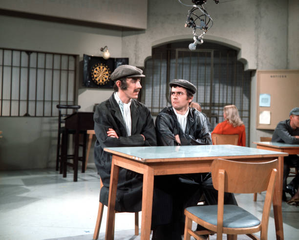 British actors and comedians Peter Cook and Dudley Moore are dres- Old Photo