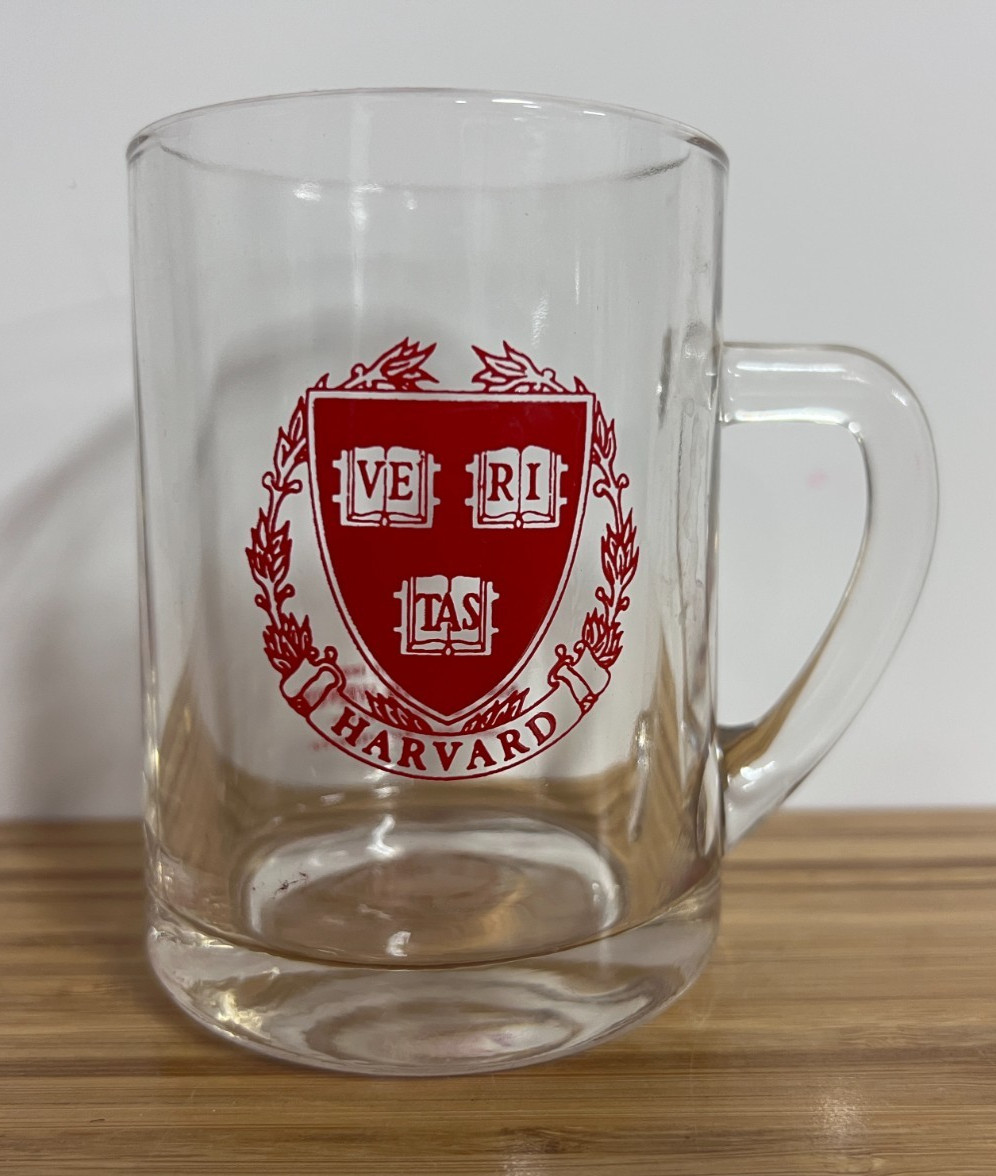 Harvard University Clear Glass Mug with red printed emblem holds 12 oz Harvard University Clear Glass Mug with red printed emblem holds 12 oz