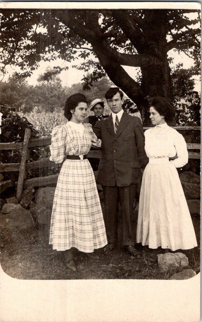 1907-10's RPPC PHOTOBOMB LOVELY LADIES HANDSOME MAN + ONE BEHIND FENCE POSTCARD