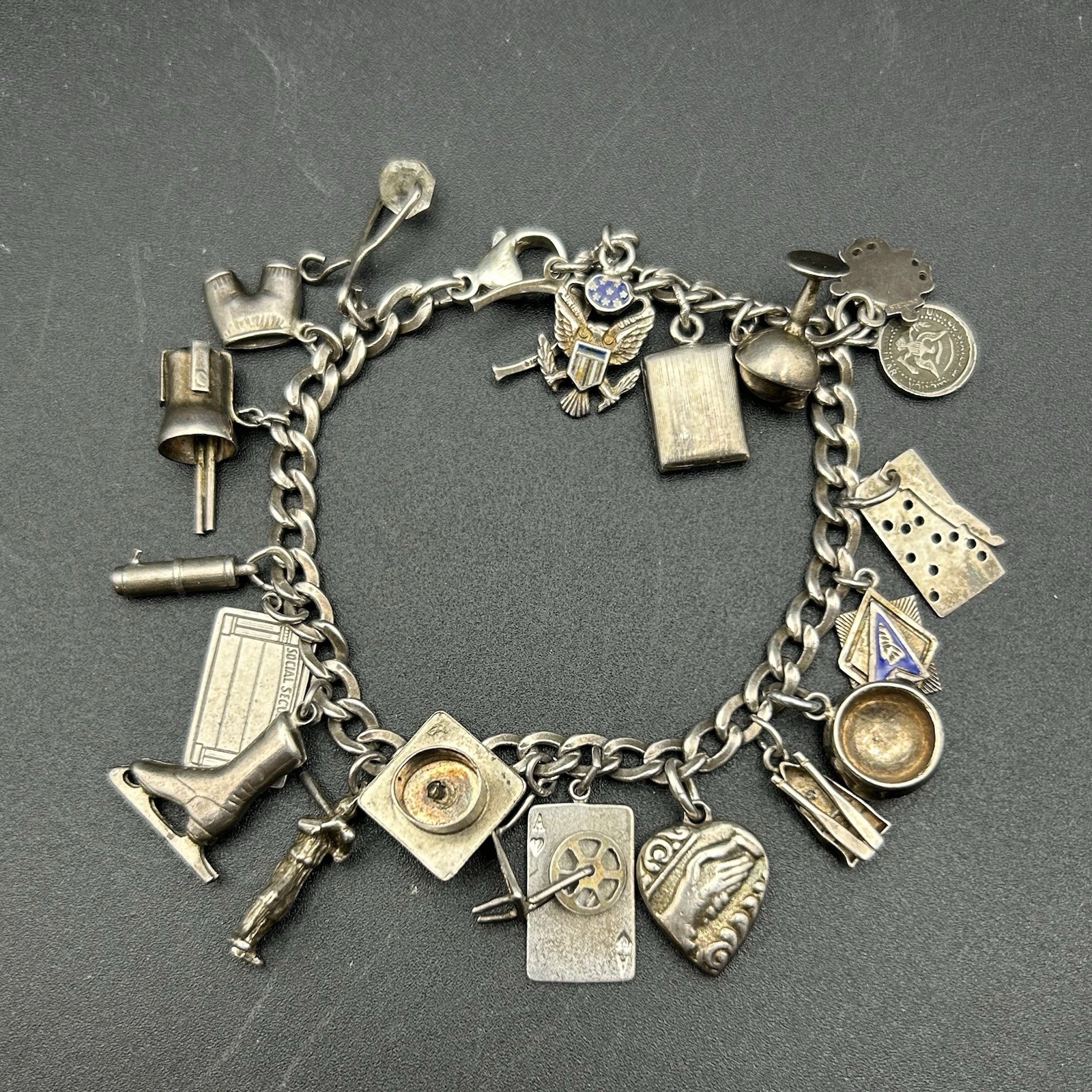Vintage Sterling Silver Charm Bracelet – 21 Unique Charms, 37 grams, 6.75” Vintage Sterling Silver Charm Bracelet – 21 Unique Charms, 37 grams, 6.75”