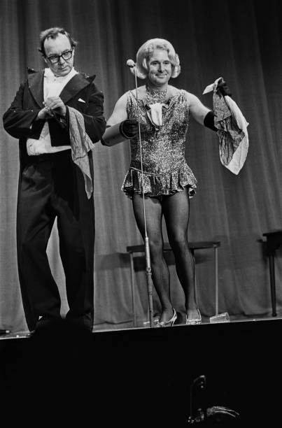 Comedians Eric Morecambe Ernie Wise acting in stage costume during- Old Photo