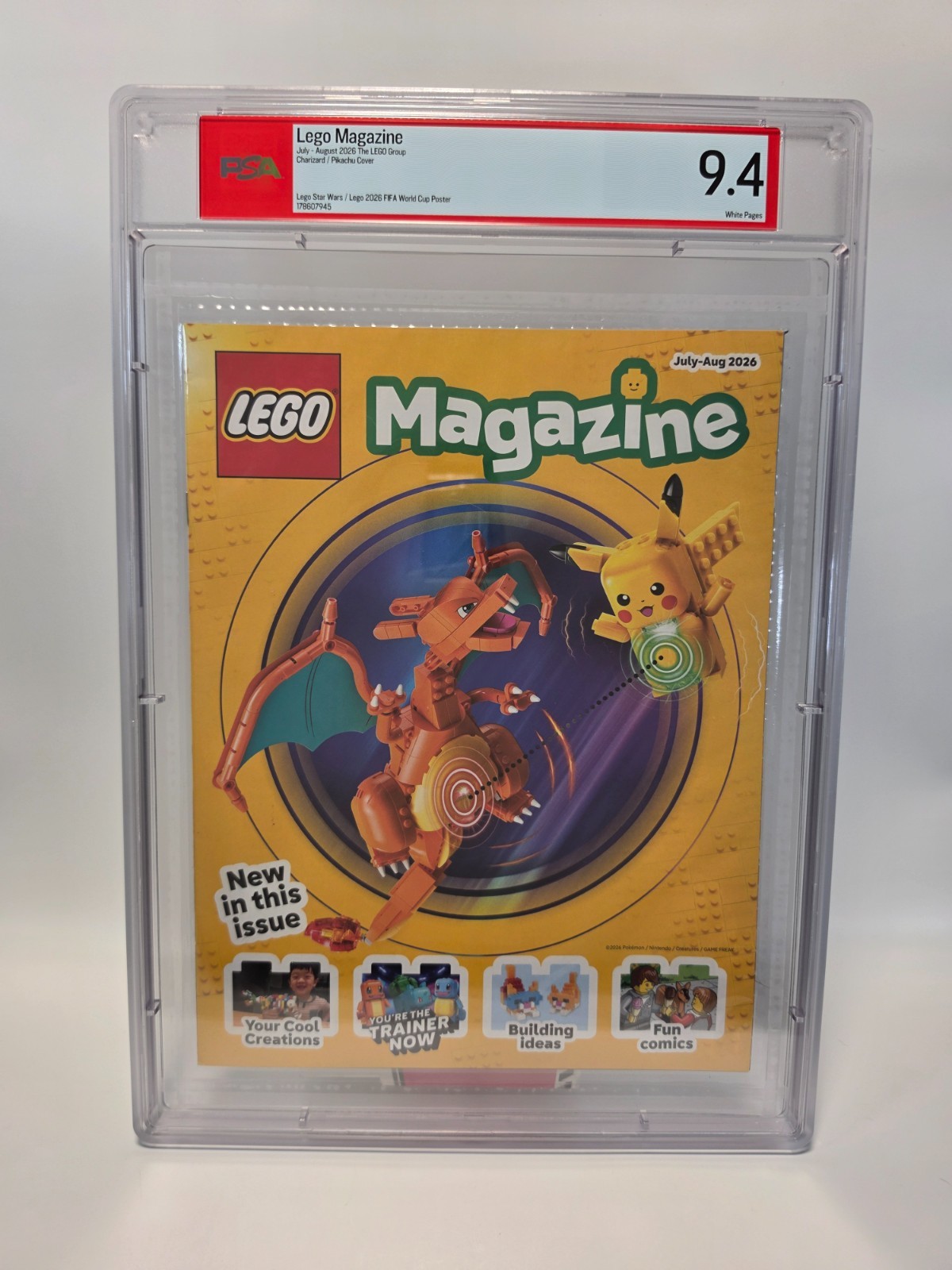 PSA 9.4 – CHARIZARD/PIKACHU LEGO MAGAZINE JULY - AUGUST 2026