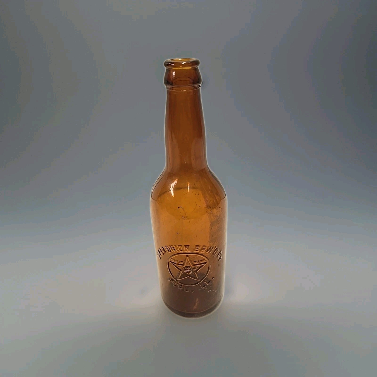 Antique Pre-Pro Embossed Amber Glass Star Union Brewing Peru IL Beer Bottle