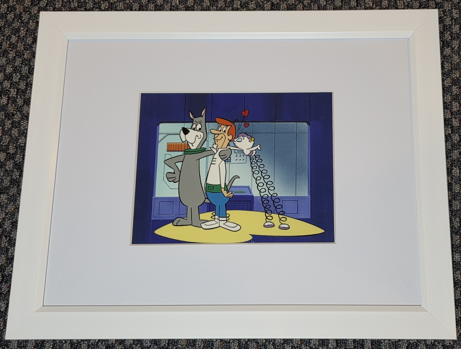 1980s JETSONS CEL OF GEORGE, ASTRO & ORBITY ON A PAINTED BACKGROUND COA & FRAMED
