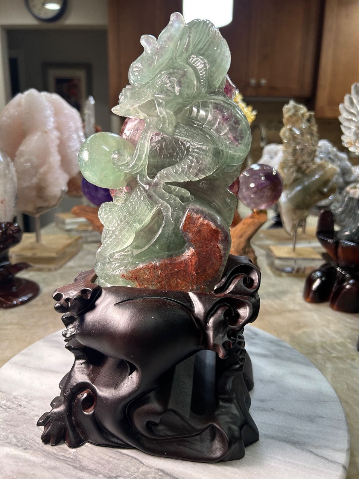 Dragon candy Fluorite UV reactive carving with custom wood stand Dragon candy Fluorite UV reactive carving with custom wood stand