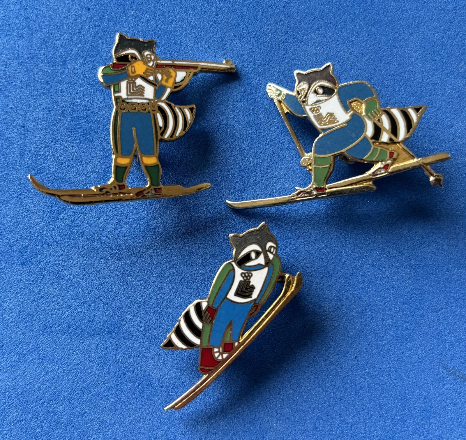 1980 LAKE PLACID WINTER OLYMPIC GAMES MASCOT- RONI RACCOON VARIOUS EVENTS 3 Pins 1980 LAKE PLACID WINTER OLYMPIC GAMES MASCOT- RONI RACCOON VARIOUS EVENTS 3 Pins