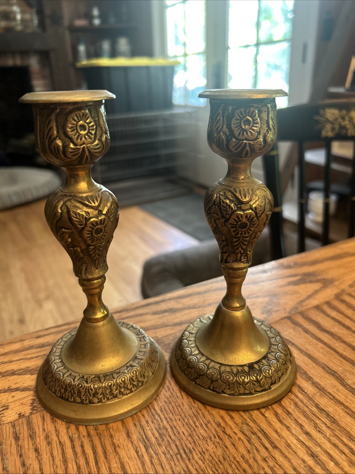 Pair Of Vintage Brass Candle Sticks With Design And Wear