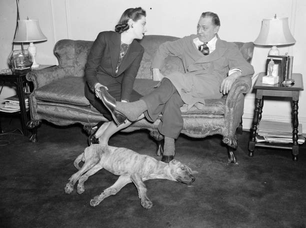 Elaine Barrie Barrymore puts slippers on her spouse John Barrymore .. Old Photo