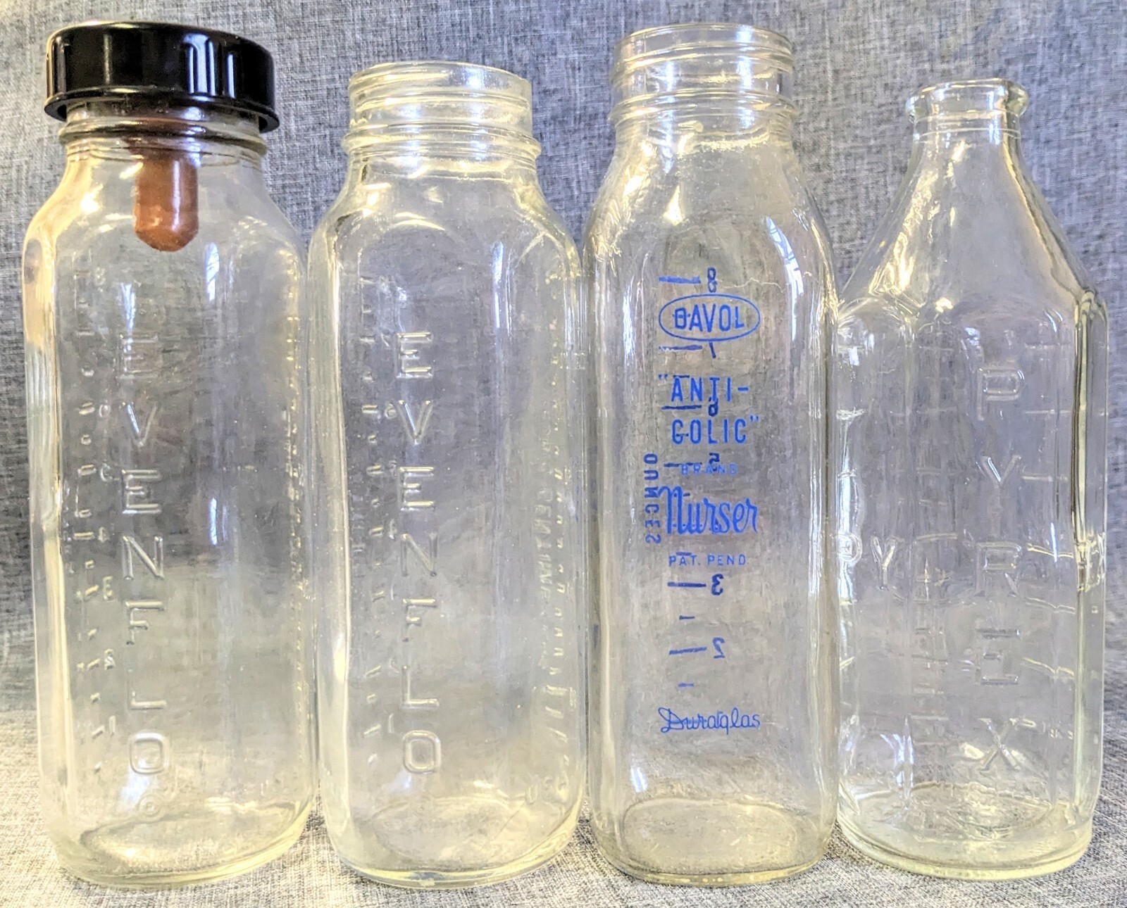Vintage Glass Baby Bottle Lot of 4 Pyrex Evenflo Davol Duraglas Bakelite Cap 8oz Vintage Glass Baby Bottle Lot of 4 Pyrex Evenflo Davol Duraglas Bakelite Cap 8oz