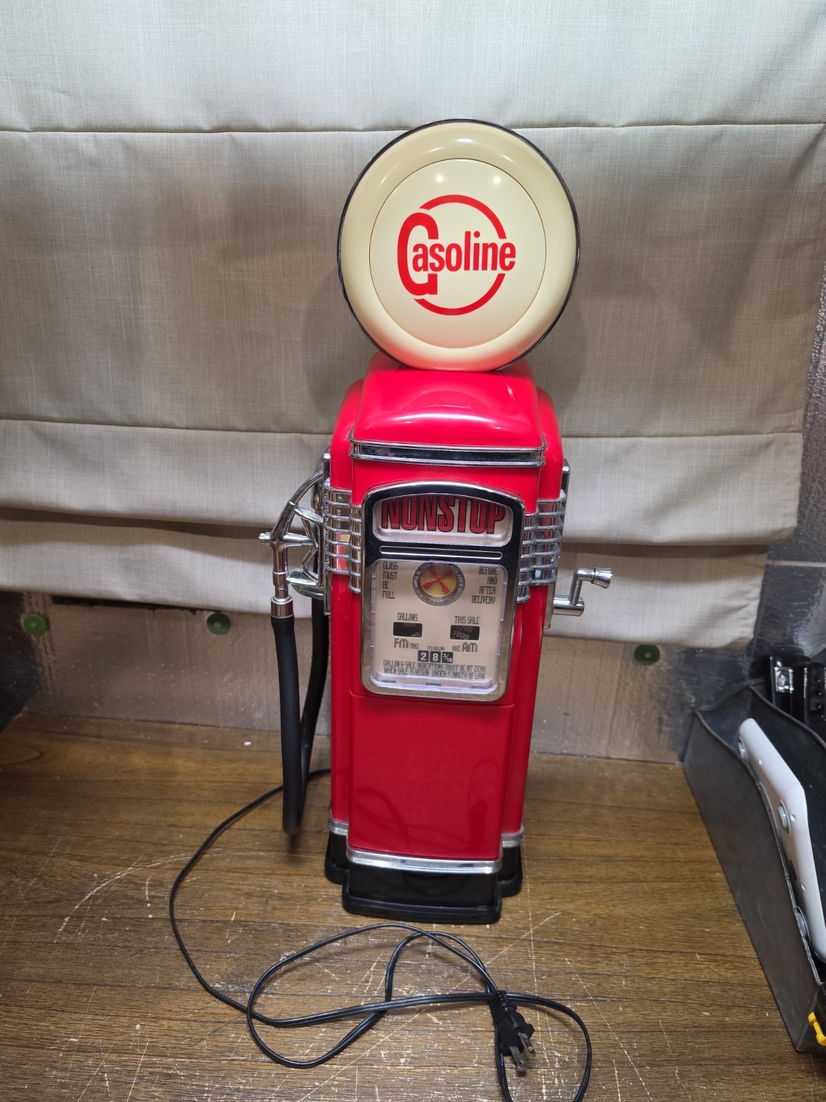 Vintage red gas pump AM/FM radio with novelty cassette player