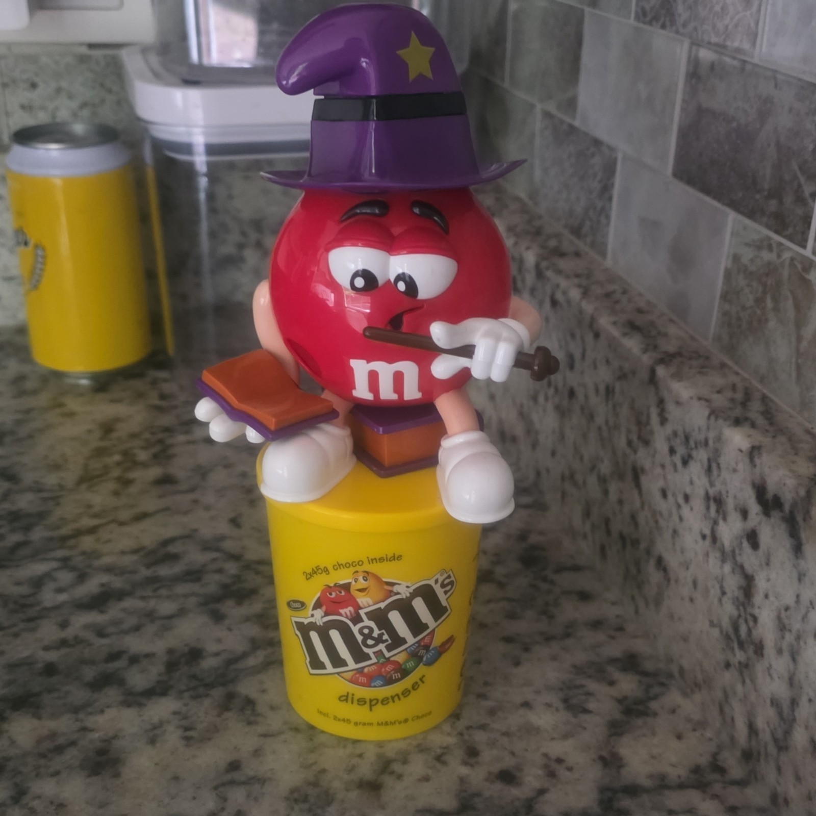 M&M\'s Candy Dispenser Red M&M Purple Hat on Yellow Base Exclusive to Europe M&M\'s Candy Dispenser Red M&M Purple Hat on Yellow Base Exclusive to Europe