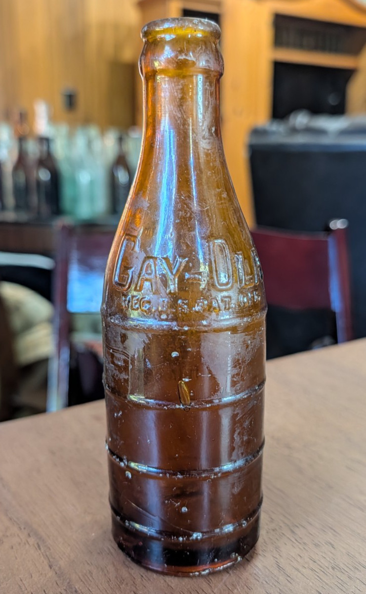 VINTAGE Amber Gay-Ola, Huntsville AL, Gay-Ola Bottling, 4-Ring Circle Slug Soda VINTAGE Amber Gay-Ola, Huntsville AL, Gay-Ola Bottling, 4-Ring Circle Slug Soda