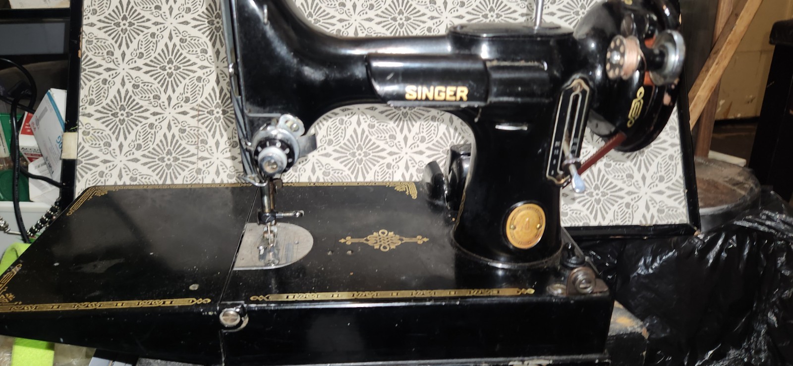 The Singer Featherweight 221 Vintage 1951 Sewing Machine with Case is a classic