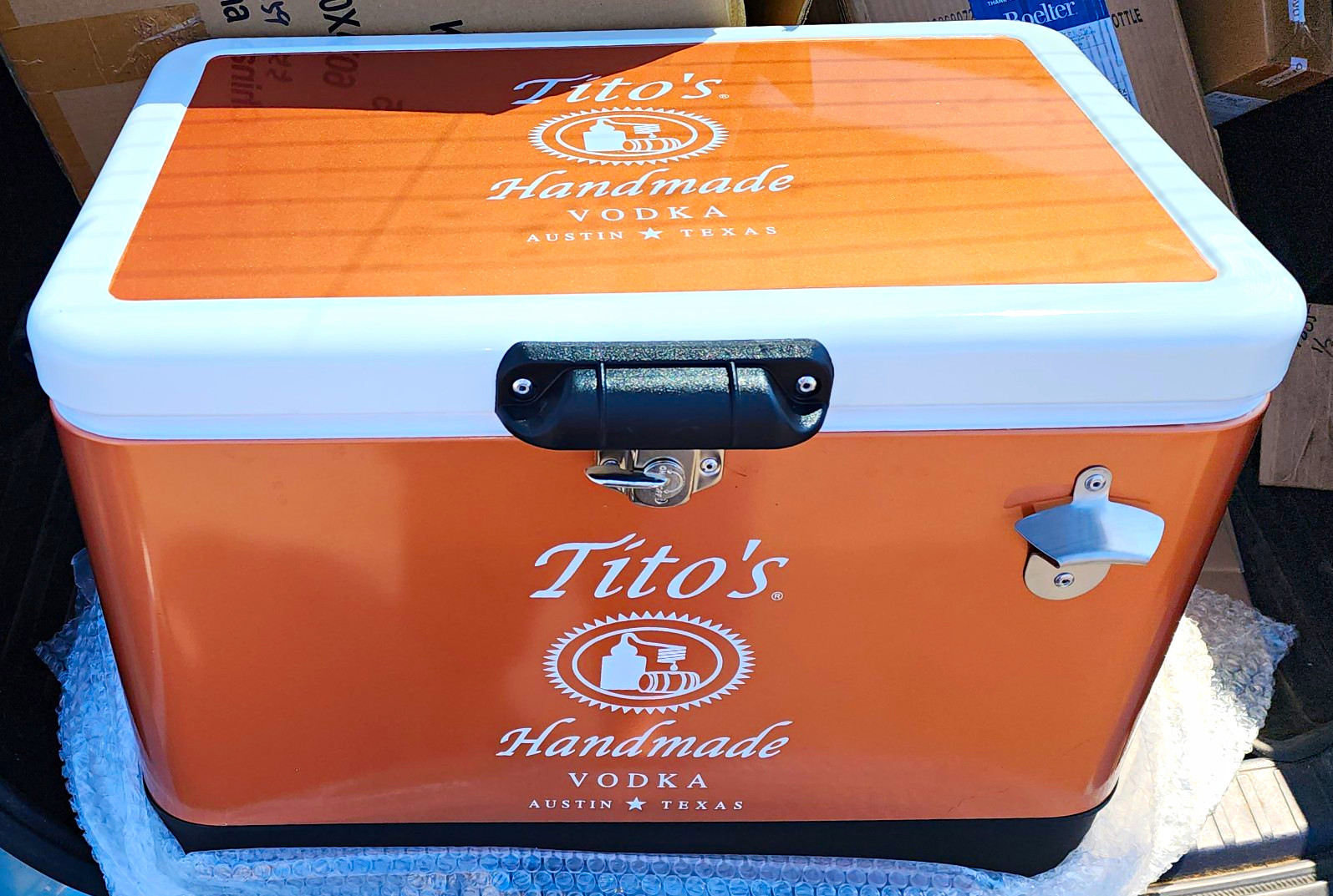 Tito's Handmade Vodka Orange Hard Cooler Ice Chest w/ Bottle Opener, White Lid Tito's Handmade Vodka Orange Hard Cooler Ice Chest w/ Bottle Opener, White Lid