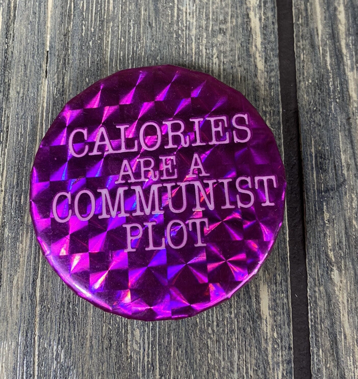 Vintage 1 5/8” Calories Are A Communist Plot Pink Pin