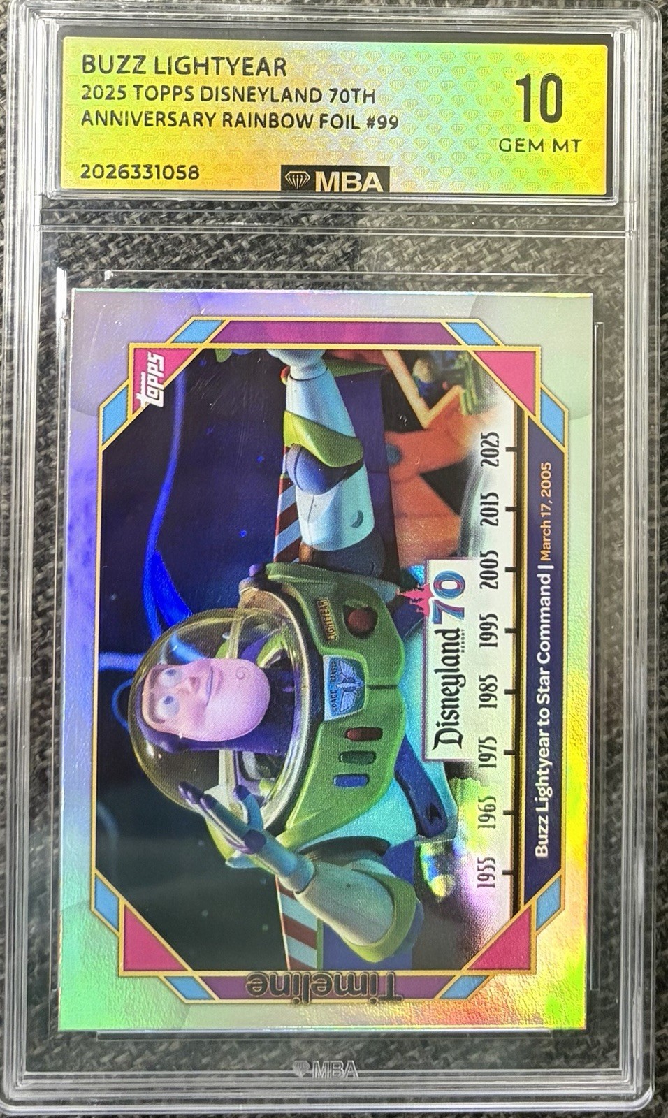 2025 Topps Disneyland 70th #99 Buzz Lightyear to Star Command Rainbow Foil GEM10