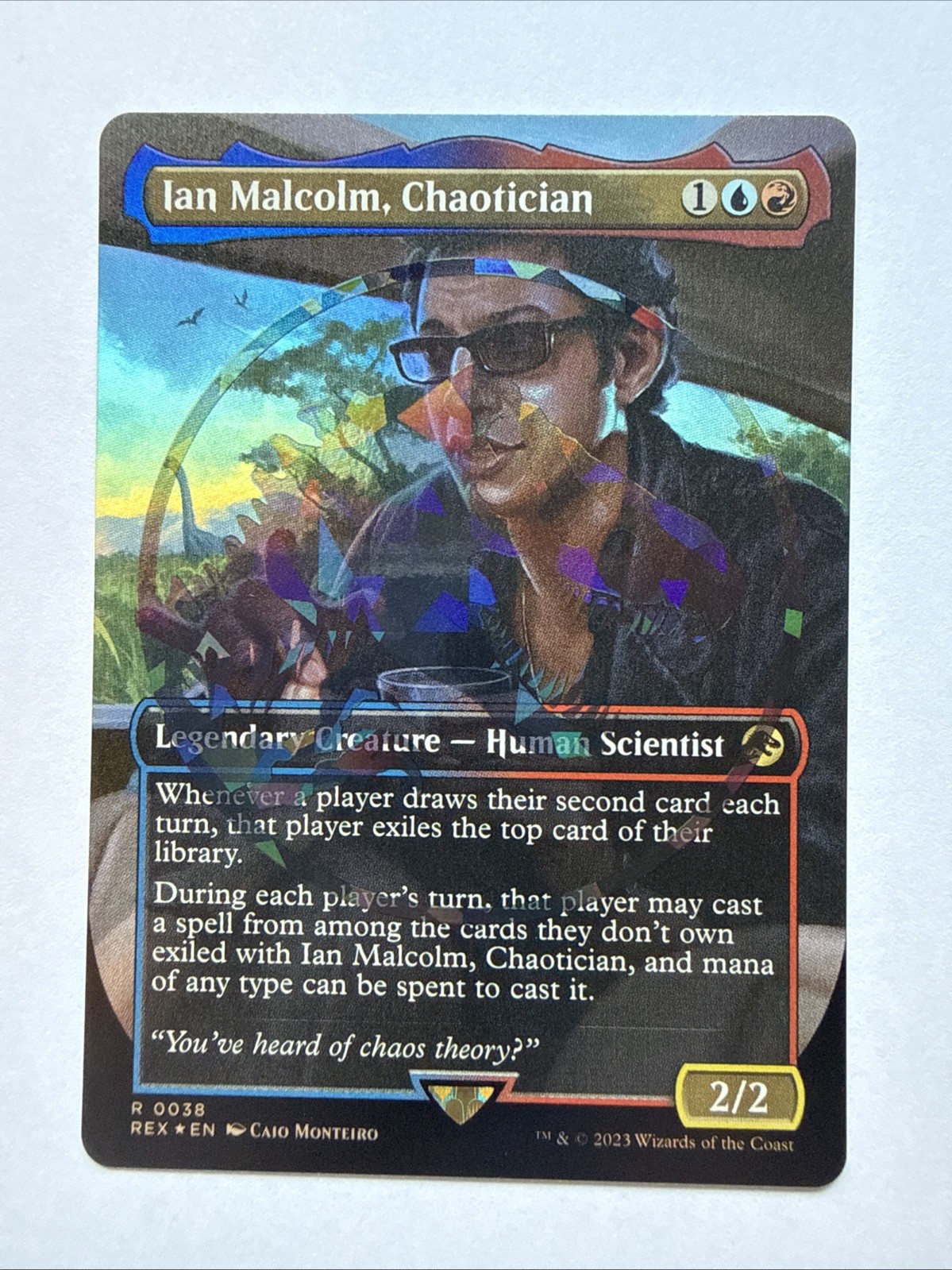 Magic: The Gathering Ian Malcolm, Chaotician Emblem Foil 0038 NM - Near Mint Magic: The Gathering Ian Malcolm, Chaotician Emblem Foil 0038 NM - Near Mint