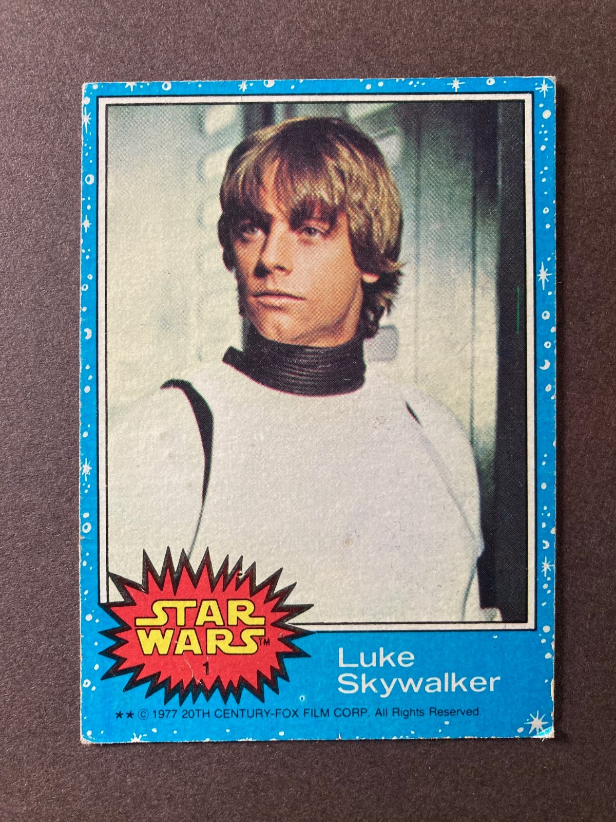 1977 Topps Star Wars Luke Skywalker #1, Series 1, Blue, RC, low-grade, creases 1977 Topps Star Wars Luke Skywalker #1, Series 1, Blue, RC, low-grade, creases