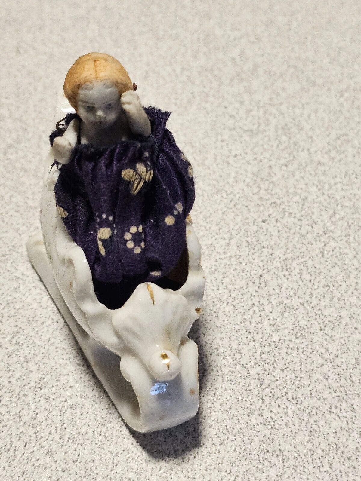 Small movable bisque doll in sled sled id made in japan . Christmas