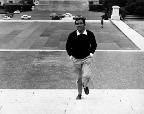 The Italian actor Ugo Tognazzi goes up stairs of a square Villa Bo- Old Photo