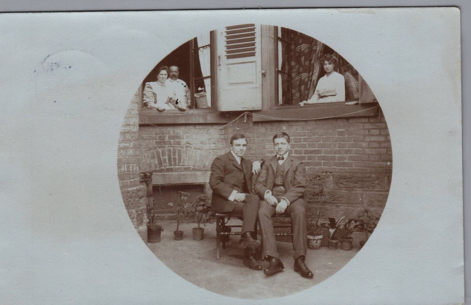 Postcard, real photo, two men in a panorama, postmarked 1907