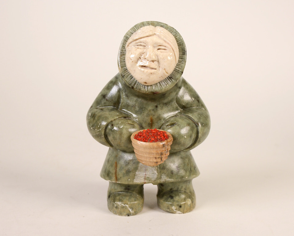 Eskimo Woman and red berries By: Ron Ekemo